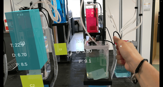 Laboratory setup with liquid containers and measurement values displayed in AR.
